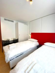 Postel nebo postele na pokoji v ubytování Citizen Suites