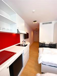 Kuchyň nebo kuchyňský kout v ubytování Citizen Suites