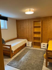 a bedroom with a bed and a book shelf at Apartment Reininghaus - Low budget in Graz