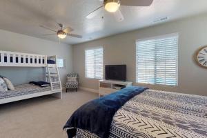 a bedroom with a bed and a tv in it at Good To Be Home where your family can relax in Washington