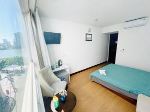 Rúm í herbergi á Onestar Danang Riverside