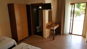 Postel nebo postele na pokoji v ubytování Felice Hotel