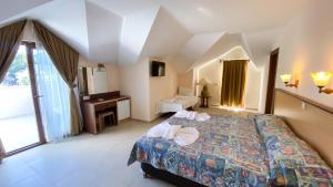 Postel nebo postele na pokoji v ubytování Felice Hotel + 37 fotografií