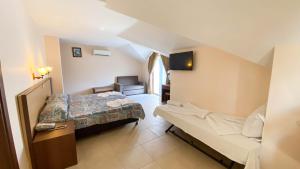 Postel nebo postele na pokoji v ubytování Felice Hotel