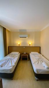 Postel nebo postele na pokoji v ubytování Felice Hotel