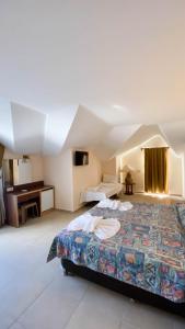 a hotel room with a bed and a desk at Felice Hotel in Kemer