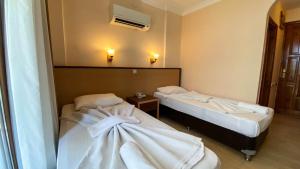 Postel nebo postele na pokoji v ubytování Felice Hotel