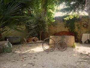 a bike sitting on the ground in a yard at Chambre d'hôtes in Lançon-Provence