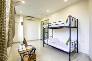Ліжко або ліжка в номері Gracious by Vishesh Hotels & Home Stay
