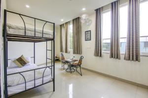 Ліжко або ліжка в номері Gracious by Vishesh Hotels & Home Stay