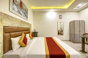 Ліжко або ліжка в номері Gracious by Vishesh Hotels & Home Stay
