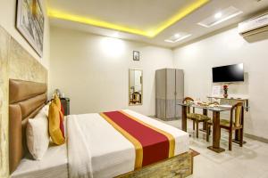 Ліжко або ліжка в номері Gracious by Vishesh Hotels & Home Stay