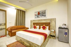 Ліжко або ліжка в номері Gracious by Vishesh Hotels & Home Stay