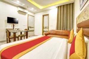 Ліжко або ліжка в номері Gracious by Vishesh Hotels & Home Stay