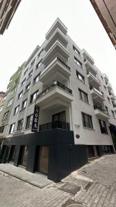 a large white building with a lot of windows at NORA SUİTE in Trabzon