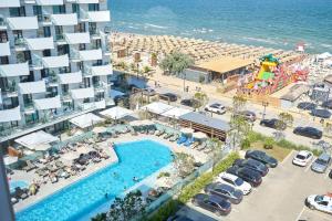 an aerial view of a resort with a pool and a beach at Smarald Sea View Apartment in Infinity Beach Resort - parking in Mamaia