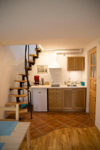 a kitchen with a staircase in the middle of a room at Wild Wine House in Gdynia