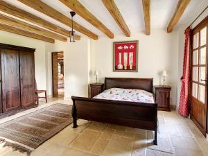 En eller flere senger på et rom på Domaine La Foret du Rossignol