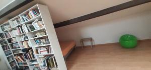 a room with two book shelves filled with books at MAISON VUE MAGISTRALE SUR LE PORT ET CALANQUES DES GOUDES MARSEILLE in Marseille