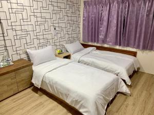 Postel nebo postele na pokoji v ubytování Fu Hwa Homestay