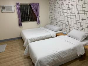 Postel nebo postele na pokoji v ubytování Fu Hwa Homestay