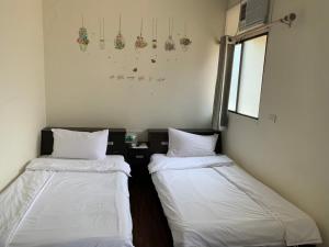 Postel nebo postele na pokoji v ubytování Fu Hwa Homestay