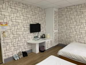 Postel nebo postele na pokoji v ubytování Fu Hwa Homestay