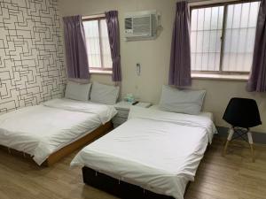 Postel nebo postele na pokoji v ubytování Fu Hwa Homestay
