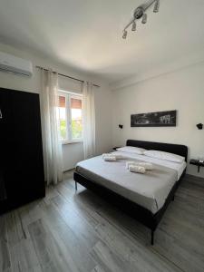 Katil atau katil-katil dalam bilik di Domus Speranza