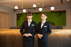 Členové personálu v ubytování Shinrin Hotel + 21 fotografií