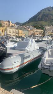 a group of boats are docked in a harbor at Le stanze di Regina Margherita in Palermo