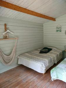 a bedroom with a bed in a room at Metsatuule puhkeküla in Hiiumaa
