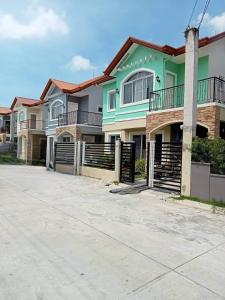 a row of houses with a driveway at MM & Naomi staycation in Mexico