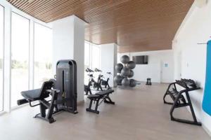 a gym with several exercise equipment in a room at Apartamento luxury frente al mar in Valencia