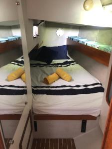 a couple of bunk beds in a boat at Casa Veleiro SHALOM in Ponta Delgada