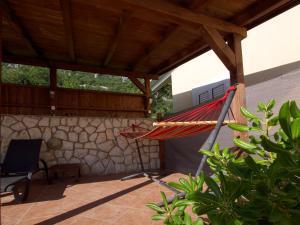 a hammock on the patio of a house at Ferienhaus Katarina in Bribir