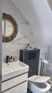 a bathroom with a sink and a mirror at Danielli Luxury Villas in Skala Rachoniou
