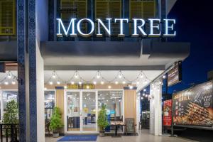 a store front with a sign for a montreal store at Montree Phuket Hotel in Phuket Town