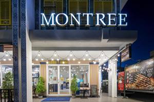 a store front with a sign for a montreal store at Montree Phuket Hotel, SHA Extra Plus in Phuket Town