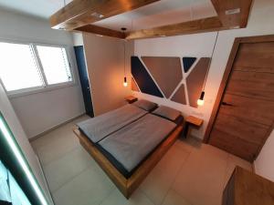 an overhead view of a bed in a room at The White Waves TF Holiday Apartment Las Americas in Playa Fañabe