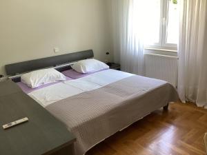 Posteľ alebo postele v izbe v ubytovaní Apartman Brankica
