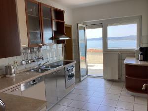Kuchyňa alebo kuchynka v ubytovaní Apartman Brankica