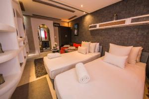 Letto o letti in una camera di Riad Hicham