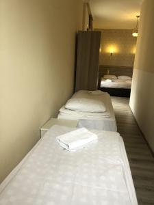 Een bed of bedden in een kamer bij Hotel My Rose