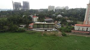 an aerial view of a city with tall buildings at Prime Casadel Rooms And Apartments in Kakkanad