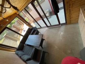 a room with a bench and a large window at Casa Marisa in Eforie Nord