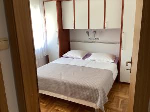 Posteľ alebo postele v izbe v ubytovaní Apartman Brankica + 37 fotografií