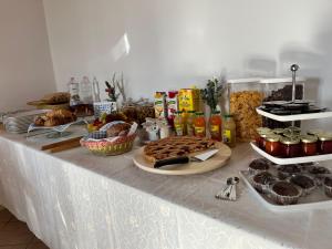 a table with a buffet of food on it at Labiente Suite & Breakfast in Peschici