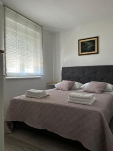 Postel nebo postele na pokoji v ubytování Apartment Rovci 2