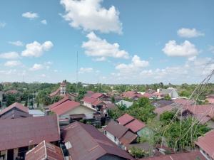 an overhead view of a town with roofs at City Inn Antang in Palangkaraya